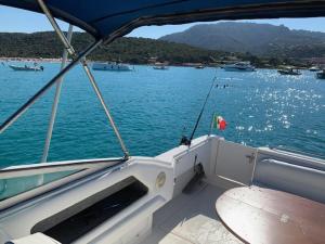 a view of the back of a boat in the water at Bed & Boat Porto Rotondo in Marinella