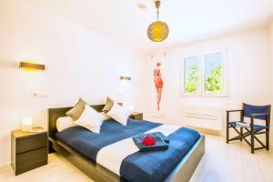 Postel nebo postele na pokoji v ubytování Casa Pura - Luxuriöses Ferienhaus mit Meerblick