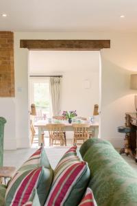 a living room with a couch and a table at Chater Barn in Leicester