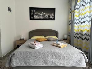 a bedroom with a bed with towels on it at Ines studioapp in Pula