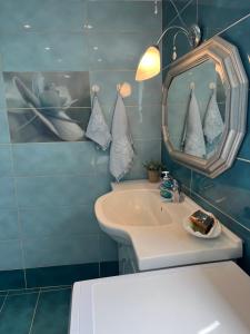 a bathroom with a sink and a mirror at Villa Palma in Skala Rachoniou +38 photos
