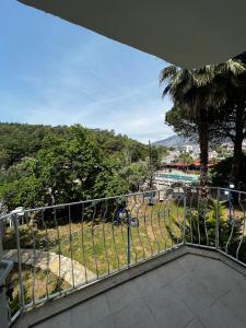 a balcony with a view of a hill at New Golden Gate Butik Otel in Muğla