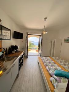 a kitchen with a bed in the middle of a room at Villa Marijam in Hvar