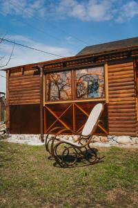 a bench sitting in front of a building at Sauna house in Daugavpils