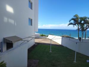 a view of the ocean from the balcony of a house at 1 St Daniel in Ramsgate