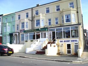 a building on the corner of a street at The Derby Hotel in Blackpool