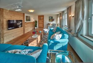 Телевизор и/или развлекательный центр в Herzo Center Apartments