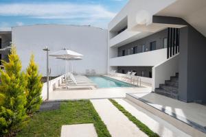 a view of a house with a swimming pool at CubeStudio21 in Kallithea Halkidikis