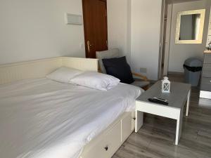 A bed or beds in a room at Atico Casa Mari