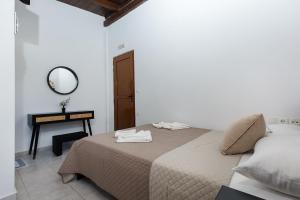 Ένα ή περισσότερα κρεβάτια σε δωμάτιο στο En Plo Beachfront Rooms