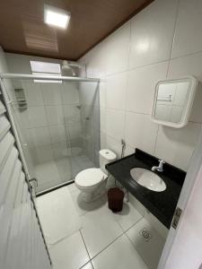 Ванная комната в Privê Vila Caraíbas
