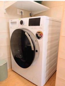 a white microwave oven sitting in a kitchen at Estudio El Ingenio de San Andrés in San Andrés +7 photos