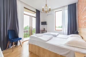 Postel nebo postele na pokoji v ubytování Hotel mia Telavi