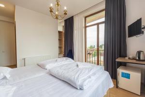 Postel nebo postele na pokoji v ubytování Hotel mia Telavi