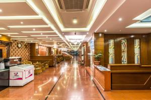 a lobby of a restaurant with a long corridor at Hotel Pokhara Goodwill in Pokhara