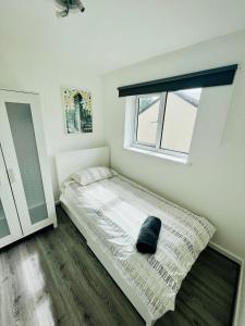 a bedroom with a bed and a window at BEA Allenby Walk in Manchester