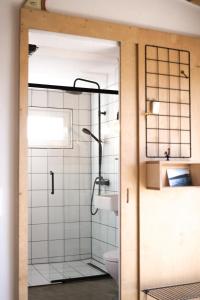 a bathroom with a shower and a toilet at Casa Mini & Casa Mia in Aljezur