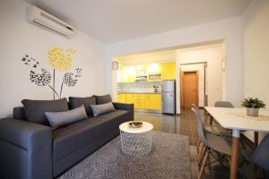 a living room with a couch and a table at Luxury Villa Nada with Pool in Petrcane