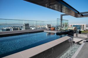 a swimming pool on the roof of a building at Magnificent penthouse with breathtaking views in Cape Town