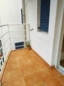 a room with a staircase and a tile floor at Studio Petlja - Igalo in Herceg-Novi