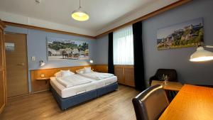 Postel nebo postele na pokoji v ubytování Alpenstadthotels
