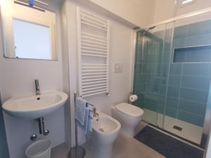 a bathroom with a sink and a toilet and a shower at Affittacamere Montecarlo in Laigueglia