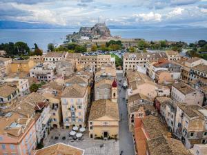 an aerial view of a town with a castle at Passaggio studio in Corfu Town