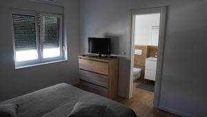 Postel nebo postele na pokoji v ubytování Apartments Jozef