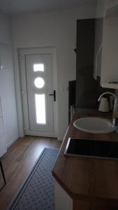 Kuchyň nebo kuchyňský kout v ubytování Apartments Jozef