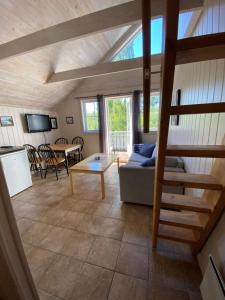 a living room with a couch and a table at Bergland apartment 28 - close to the center of Kragerø in Kragerø