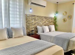 Een bed of bedden in een kamer bij Villa Marot Eventos