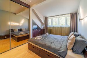 Ένα ή περισσότερα κρεβάτια σε δωμάτιο στο Grand Apt with air conditioning