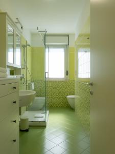 a bathroom with a sink and a shower and a toilet at Franci Loft in Pescara