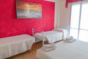 Postel nebo postele na pokoji v ubytování Hotel Maxim