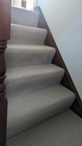 a set of stairs in a home with a stair case at Elegant Relaxed Studio in Maynooth