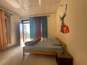 Łóżko lub łóżka w pokoju w obiekcie Bir Nest Hostel