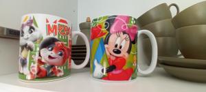 a group of mickeys coffee mugs sitting on a counter at Casina al mare in Cecina +48 photos