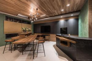 a dining room with a table and some chairs at ShanHeShu Homestay in Hualien City