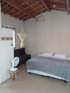 Postel nebo postele na pokoji v ubytování Vila Sincorá - Chalé para 4 pessoas com cozinha a 2 km da portaria da Cachoeira do Buracão