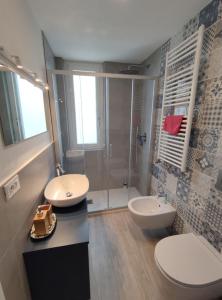a bathroom with two sinks and a shower at Casa Charlotte in Rapallo