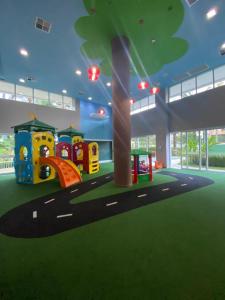 a childrens play area with a playground in a building at Cobertura Ilha da Madeira in Riviera de São Lourenço