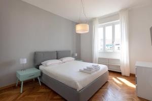 A bed or beds in a room at Gaffurio Apartments