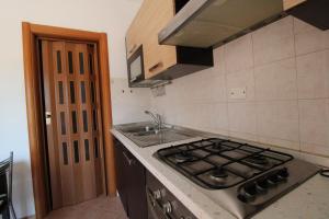 A kitchen or kitchenette at Appartamento Gori