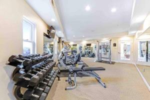 a gym with treadmills and ellipticals in a room at Sports Themed 2bedApt w BEST location fully stocked 2 parking in Santa Clara