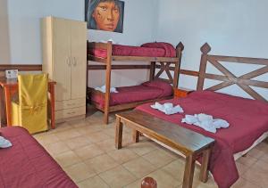 Cama ou camas em um quarto em Hostería Austral