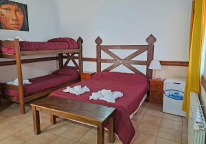 Cama ou camas em um quarto em Hostería Austral