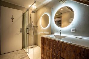 a bathroom with a sink and a mirror at La grange au ruisseau in Bellecombe-en-Beauges +38 photos
