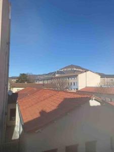 an overhead view of a building with a red roof at L'appart de la liberté in Millau
