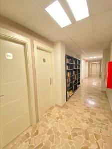 an empty room with a door and a hallway at Primavera in Levanto