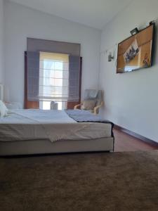Postel nebo postele na pokoji v ubytování Villa Infinity